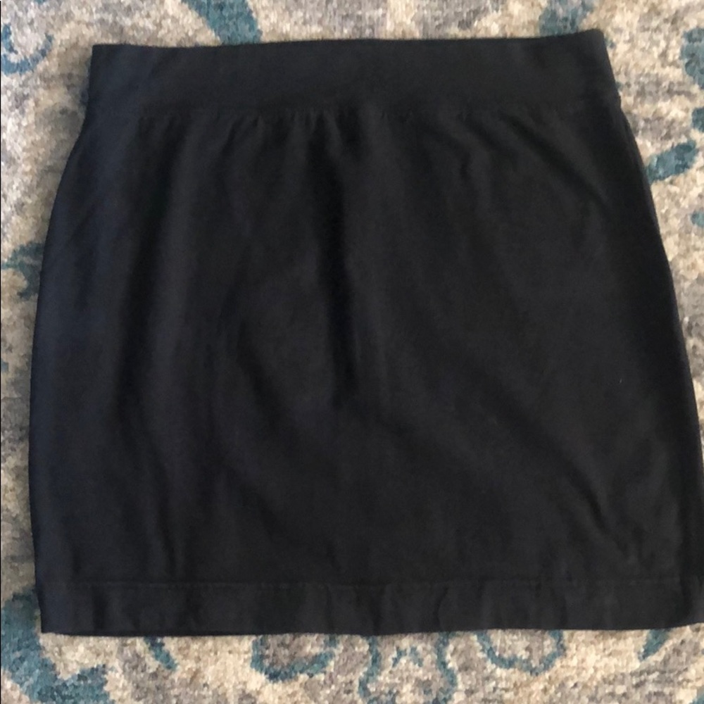 Black Victoria’s Secret mini skirt.